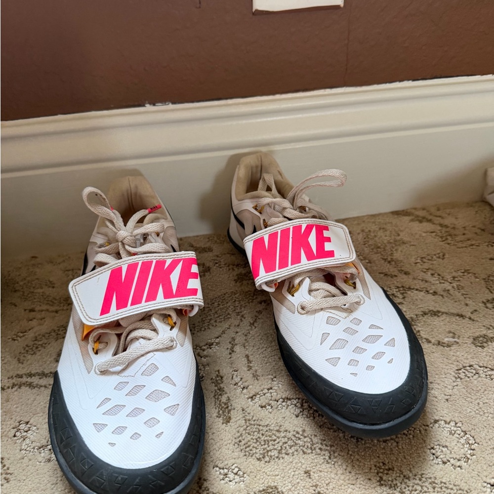 Nike Kids White and Pink tack throwing shoes